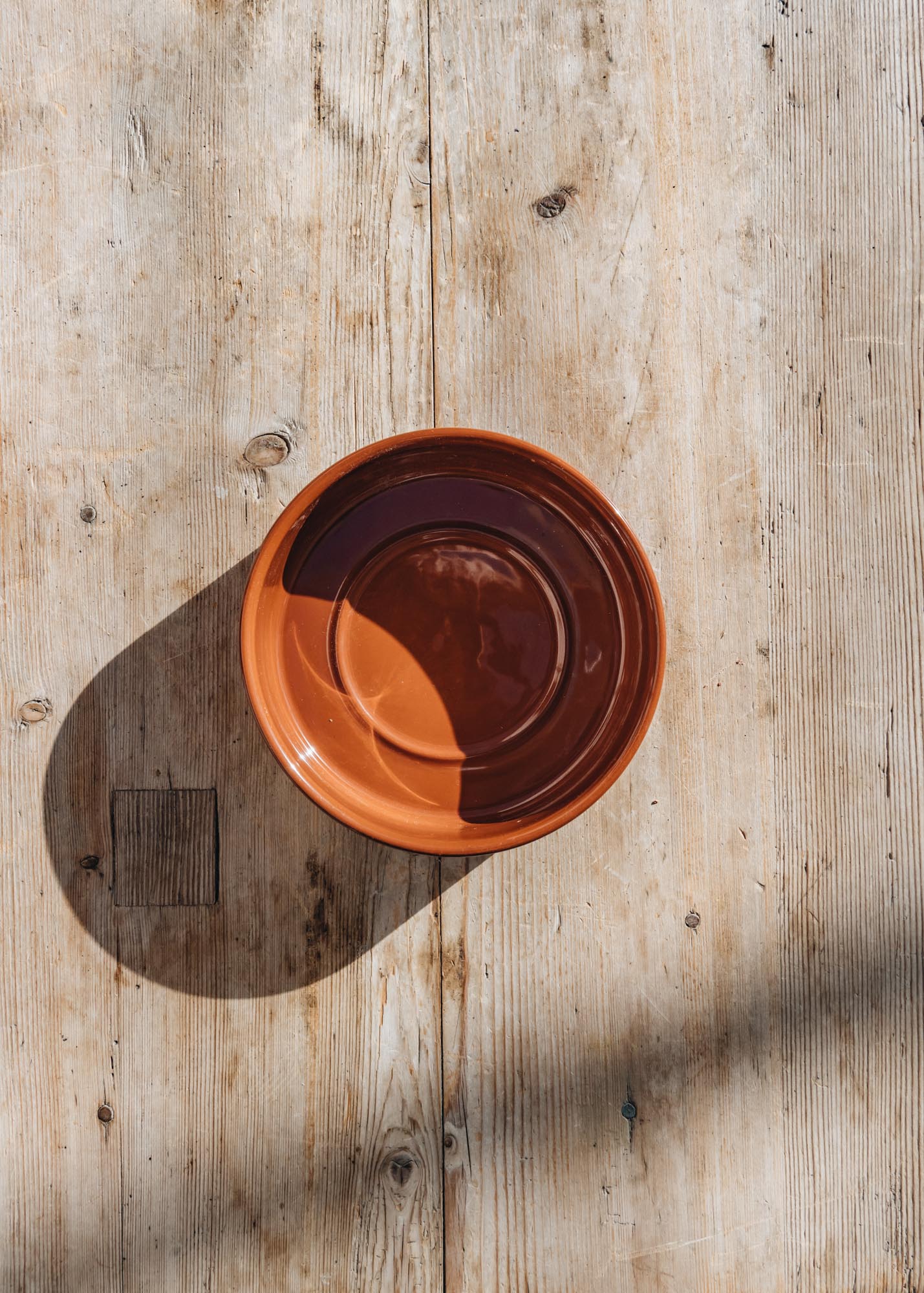 Rusty Red Glazed Hoff Saucers