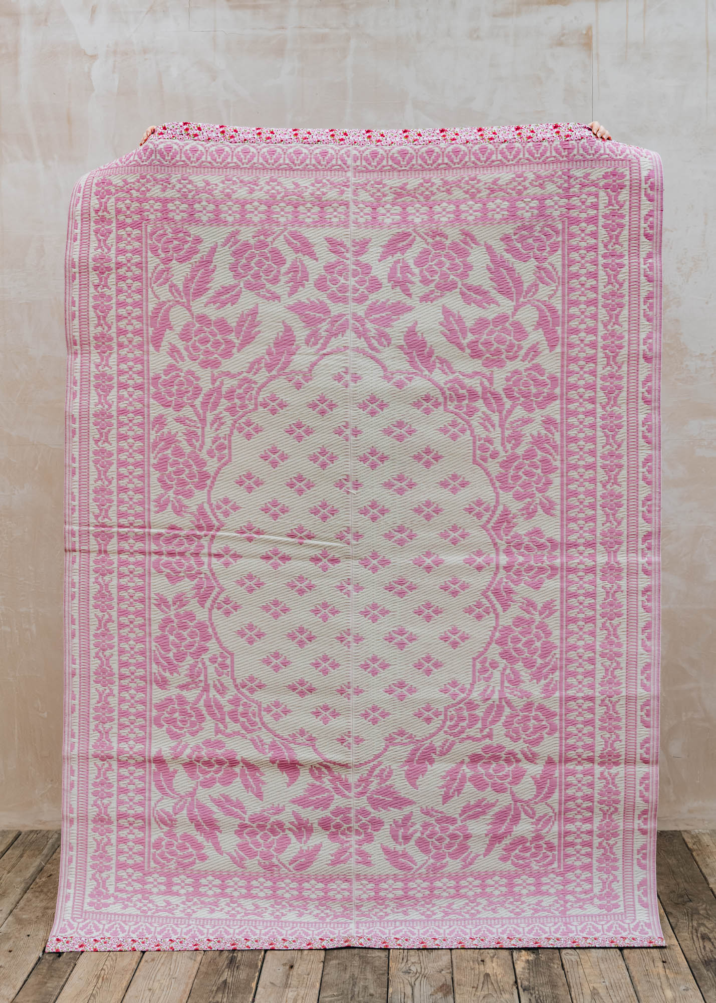 Outdoor Recycled Plastic Carpet in Pink with Flower Borders, 210cm x 150cm