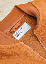 Universal Works Wool Fleece Zip Waistcoat in Rust